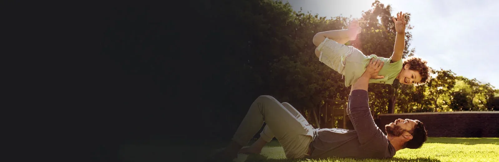 Father and son playing outside in mosquito free yard